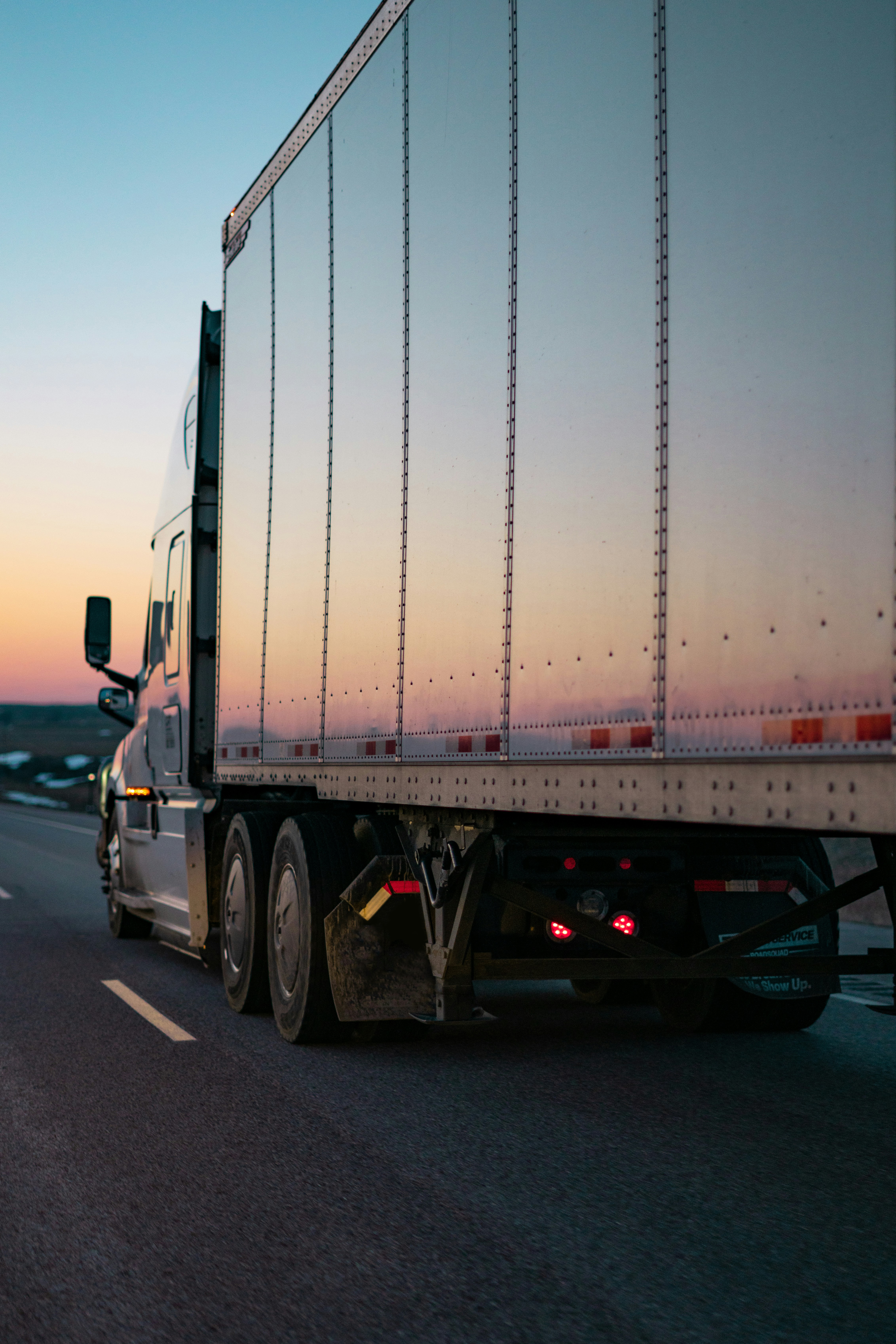 Freight trailer on the road at sunset